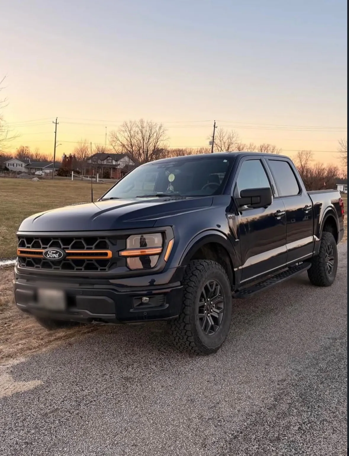 A black Ford F-150 pickup truck