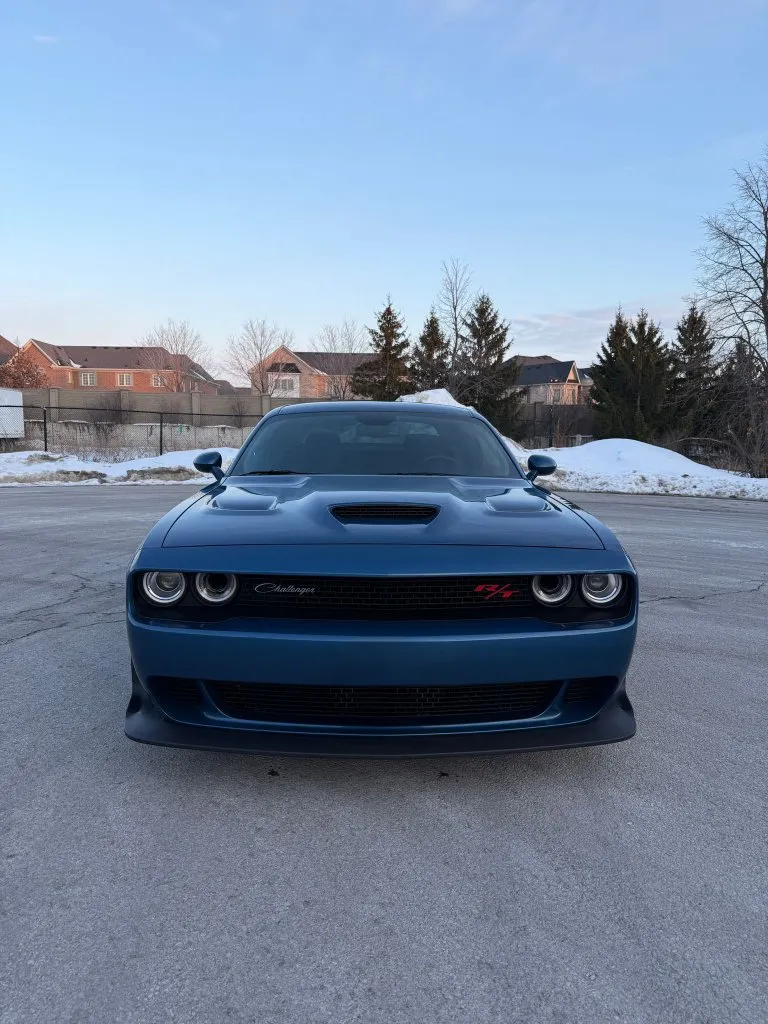 A blue Dodge Challenger R/T Scat Pack